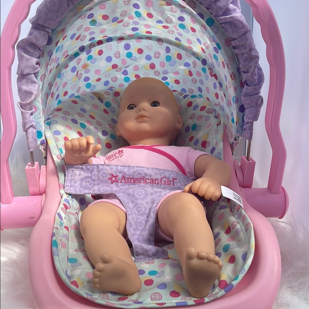 American Girl Baby Doll with Pink and Purple Car Seat